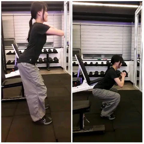 Person Practicing Squats in Gym