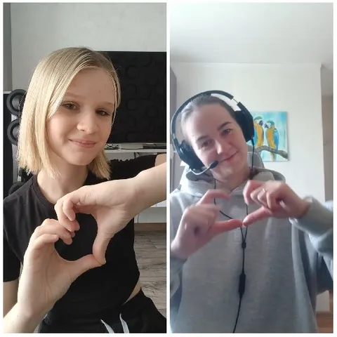Two People Making Heart Shapes