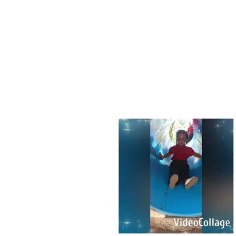 Child Joyfully Sliding Down Tube Slide