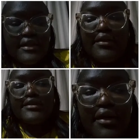 Person in Glasses in Dim Light