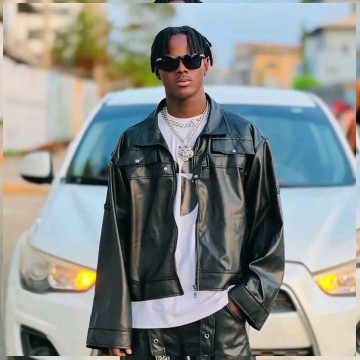 Person in Leather Jacket by Car