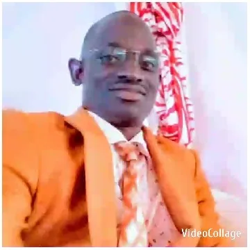Smiling Individual in Orange Suit