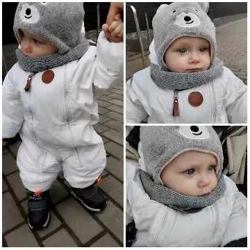 Child in Snowsuit Holding Hand