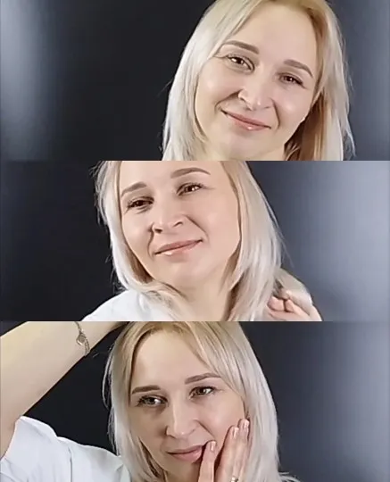 Woman Smiling Against Dark Background