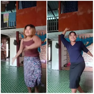 Women Dancing in Indoor Setting