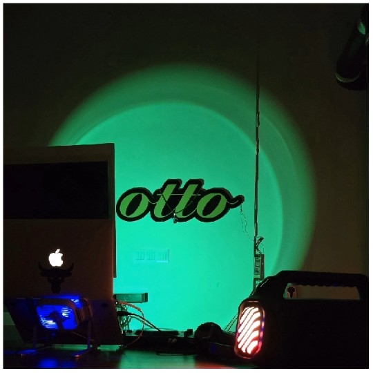 Dim Room with Laptop and Green Light