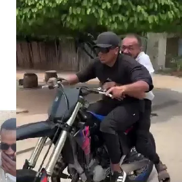 Riding Motorcycle on City Street