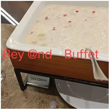 Buffet Setup with Rice Pudding Dish