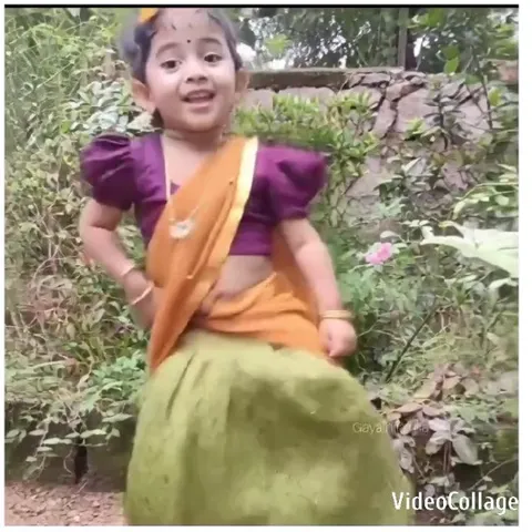 Child in Indian Attire Dancing in Garden