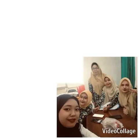 Women Smiling at Table with Papers