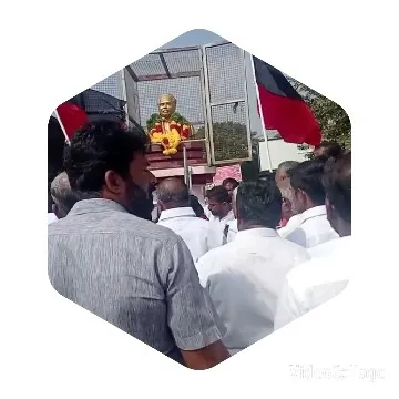 Gathering Around Decorated Statue