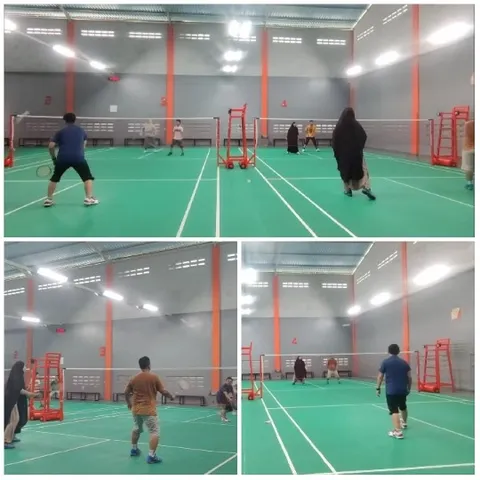 People Playing Badminton Indoors