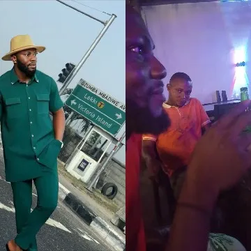 Man by Street Sign Interacting with Others