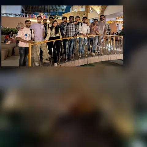 Smiling Group on Bridge Railing