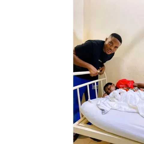 Man by Child's Hospital Bed