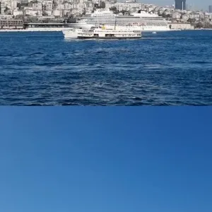 Ferry Cruising Near City Skyline