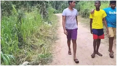 Friends Walking on Dirt Path