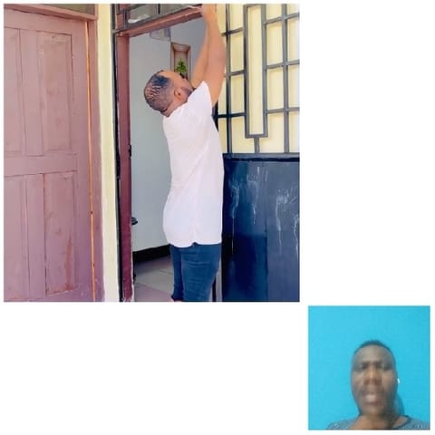 Man Reaching Towards Door Frame