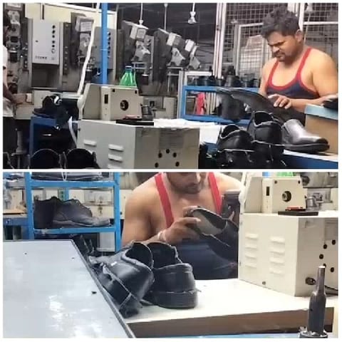 Man Inspecting Shoes in Factory