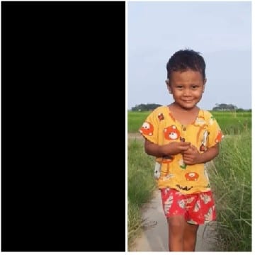 Child Smiling in Colorful Outdoor Shirt