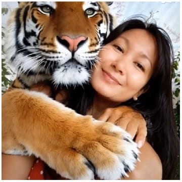 Woman Embracing a Gentle Tiger