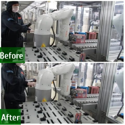 Robotic Arm with Worker in Factory
