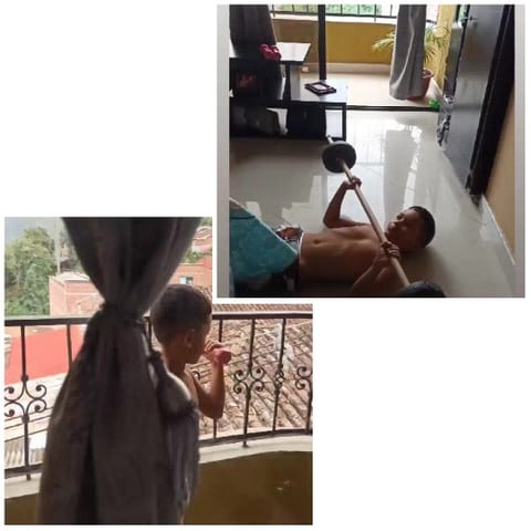 Boy Lifting Barbell at Home