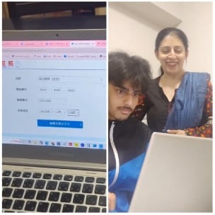Looking at Laptop with Smiles