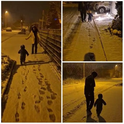 Family Walking in Snowy Night