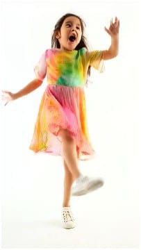 Girl Jumping in Rainbow Dress