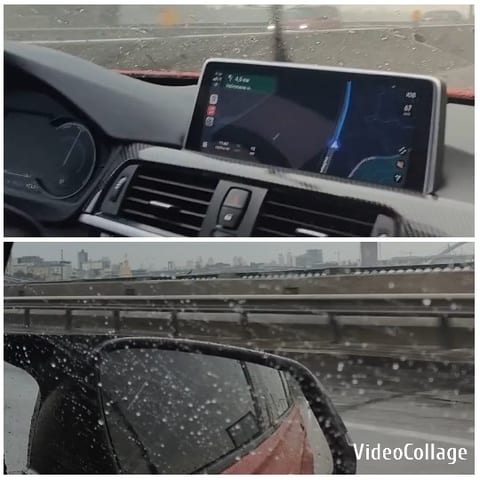 Car Dashboard and Rainy City View