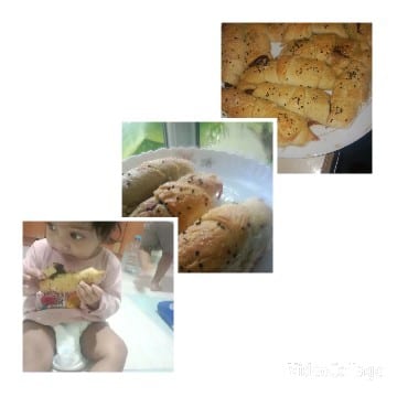 Child Enjoying Baked Rolls