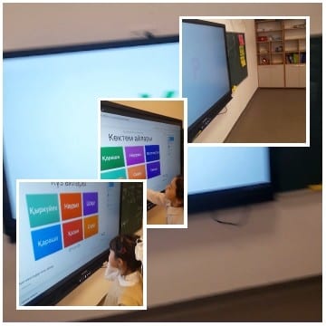 Child Pointing at Digital Screen