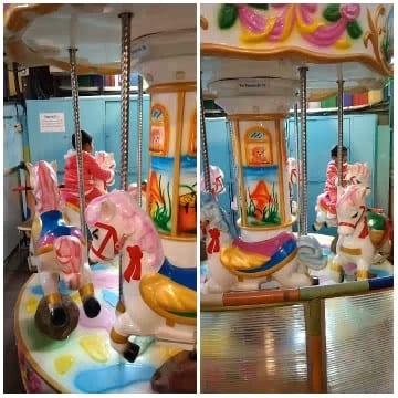 Children on Colorful Carousel