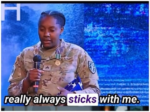 Military Person Holding American Flag