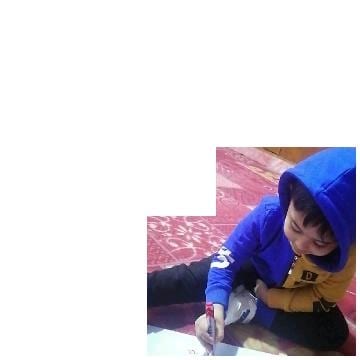 Child Drawing on Patterned Carpet