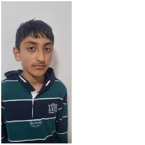 Young Person in Striped Hoodie