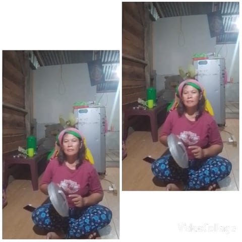 Woman with Pan Lid in Kitchen