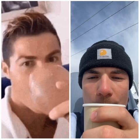 Two People Drinking From Cups