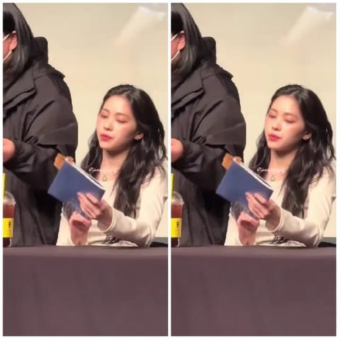 Person with Book at Indoor Event