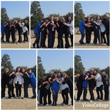 Group Smiling in Outdoor Setting