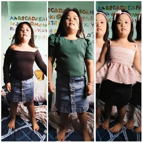 Three Young Children Posing Indoors