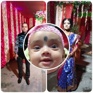 Formal Man, Baby, and Woman in Sari