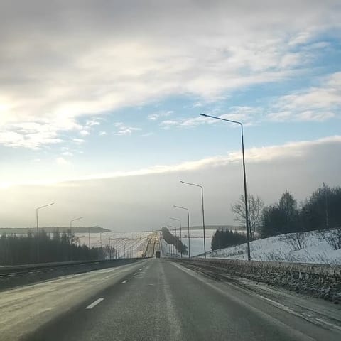 Snowy Road Leading to Horizon