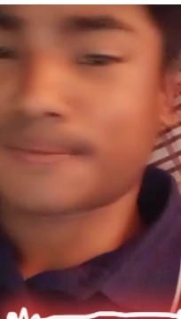 Person with Blurred Face in Striped Background