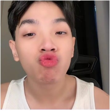 Duck Face Expression in Tank Top