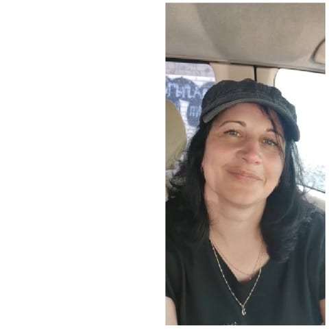 Smiling Person Inside a Car