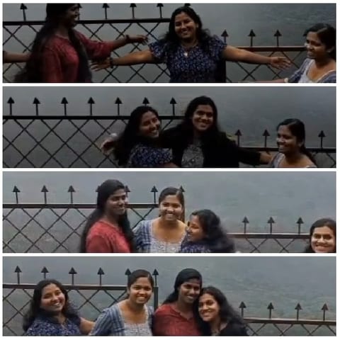 Women Posing by Metal Fence
