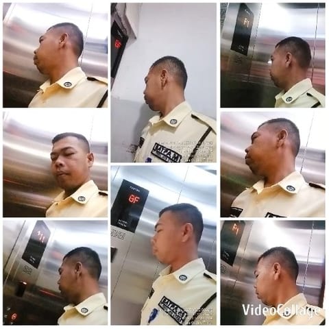 Man Monitoring Elevator Interior