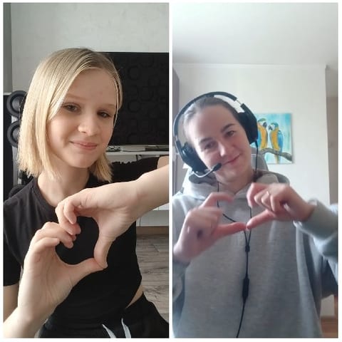Two People Making Heart Shapes